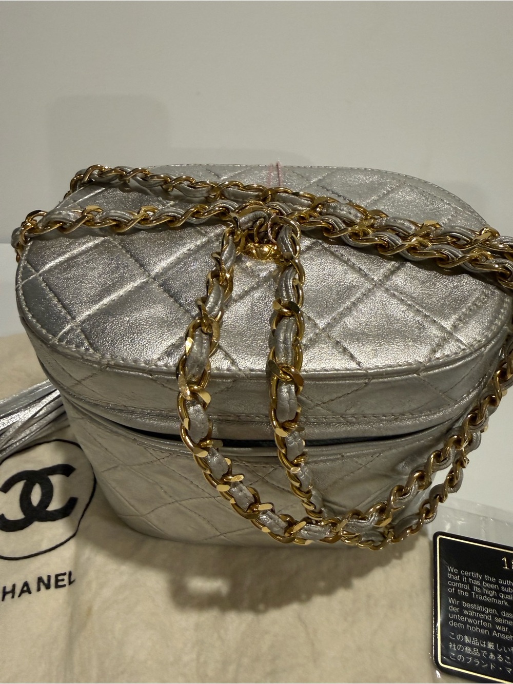 Authentic CHANEL Silver Vanity Crossbody with Gold-Tone Chain/ tassel. Series 1